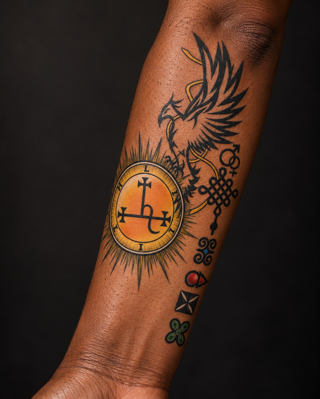 Original eagle, seal and symbolic artwork shown as a finished tattoo from a woman’s wrist to elbow